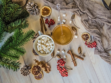 autumn still life with honey, Rowan, marshmallows, pine and cones, lemon, leaves, on white wooden background top view. object groupの写真素材