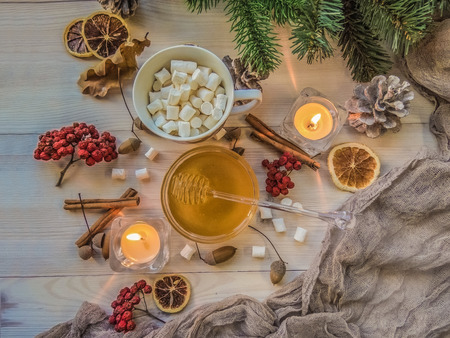 autumn still life with honey, Rowan, marshmallows, pine and cones, lemon, leaves, on white wooden background top view. object groupの写真素材