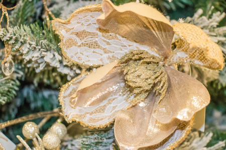 Christmas tree decorations. Christmas tree with beautiful shiny flowers and butterflies. Winter holidays concept. winter holidays.の写真素材