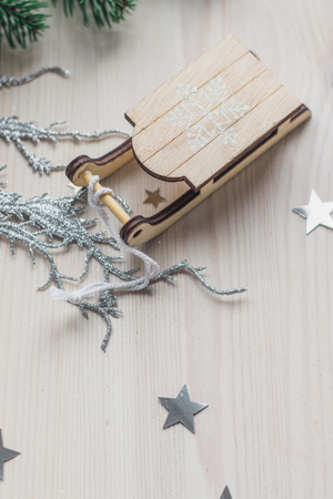 Santa Claus sleigh on a white wooden background with christmas tree space for textの写真素材