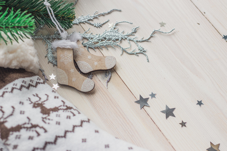 Wooden Christmas decorations - Christmas socks on a white wooden background with a Christmas tree space for textの写真素材