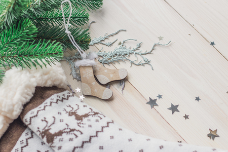 Wooden Christmas decorations - Christmas socks on a white wooden background with a Christmas tree space for textの写真素材