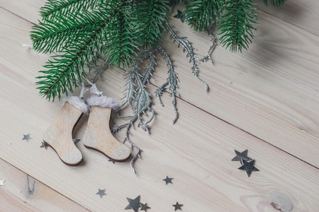 Wooden Christmas decorations - Christmas socks on a white wooden background with a Christmas tree space for textの写真素材
