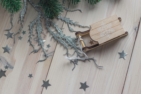 Santa Claus sleigh on a white wooden background with christmas tree space for textの写真素材
