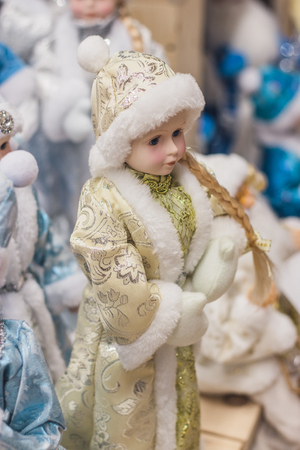 Christmas girl dolls, snow maiden for presesents or decoration, carry gifts sale, market, realization in the shop, supermarketの写真素材