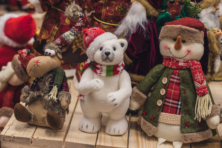 Christmas toys made of wool, beautiful deer, a white bear and a snowman are sold in the store, market, realization in the shop, supermarketの写真素材