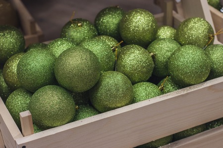 Green glittering balls. New Year decoration. balls in the wooden box. New Year's celebration. Illustration for the holiday new year. ball groupの写真素材