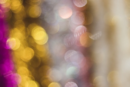 Blurred bokeh background with New Year's colorful tinsel. Christmas concept. Place for text Happy New Year.の写真素材