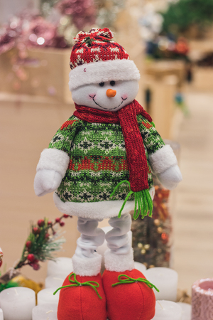 Christmas toys made of wool, beautiful deer, a white bear and a snowman are sold in the store, market, realization in the shop, supermarketの写真素材