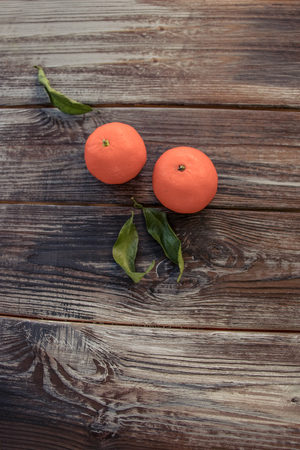 Mandarins Tangerines on wooden background. Free space for your text. color of the year 2019 Living Coralの写真素材