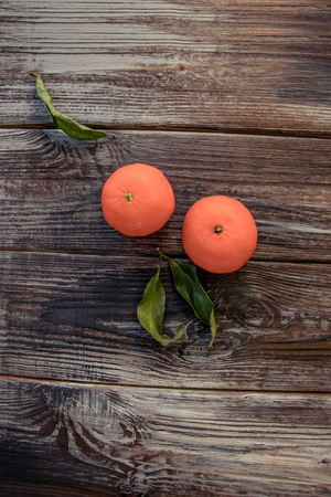 Mandarins Tangerines on wooden background. Free space for your text. color of the year 2019 Living Coralの写真素材