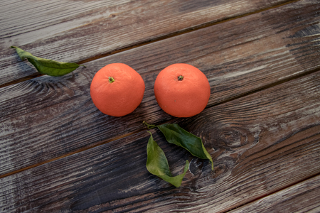 Mandarins Tangerines on wooden background. Free space for your text. color of the year 2019 Living Coralの写真素材