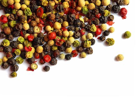 Various kinds of seeds of pepper on a white backgroundの写真素材
