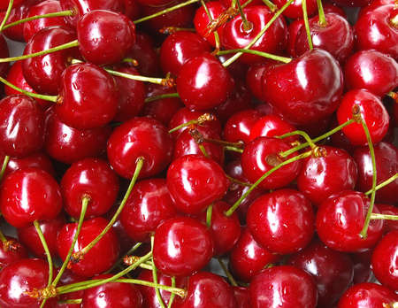 Background from sweet fresh wet red cherriesの写真素材