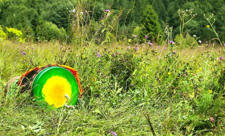 African colorful drum, lying in the grassの写真素材