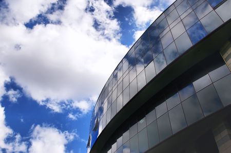 Office building on the blue sky background  with cloudsの写真素材