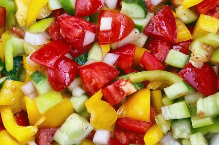 Salad from fresh vegetables - pepper, onion, cucumber and tomatoesの写真素材
