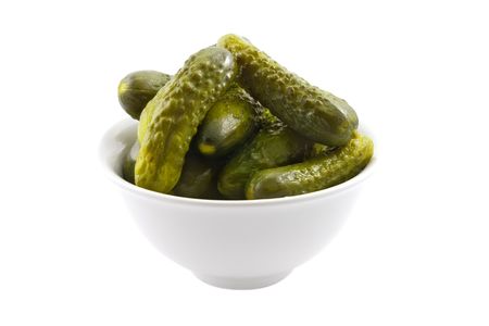 Bowl with marinated cucumbers on the whiteの写真素材