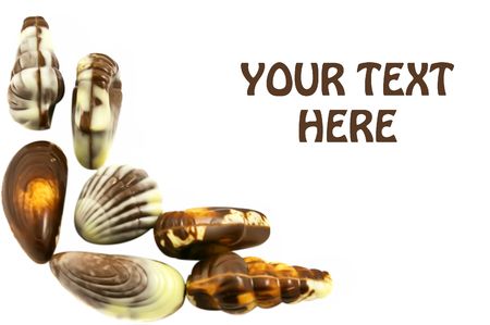Chocolate seashells frame with copy spaceの写真素材