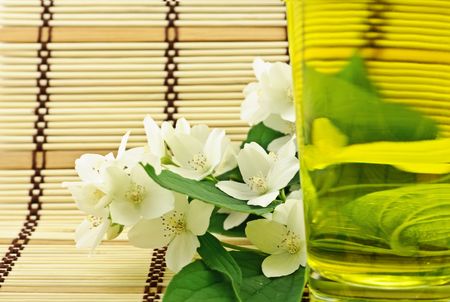Fresh green tea with jasmin white flowersの写真素材