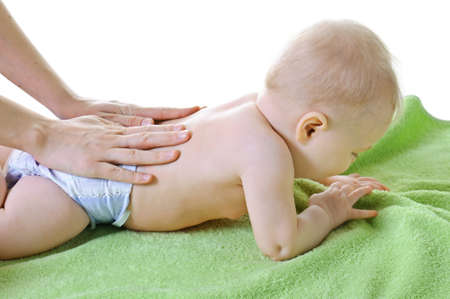 Mother massaging babyの写真素材