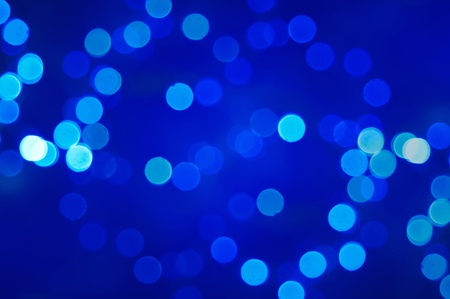 Christmas shiny light bokeh in  blue colorsの写真素材