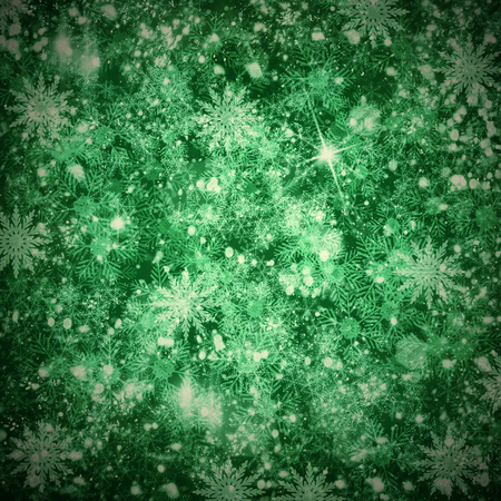 Christmas shiny textured  snow background with snowflakes and copy space in green colorsの写真素材