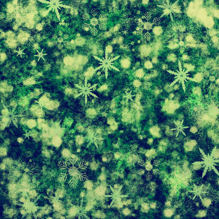 Green christmas grunge holiday background  with snowflakesの写真素材