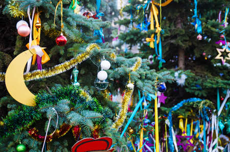 Christmas decorations on the fir  tree branches, holiday backgroundの写真素材