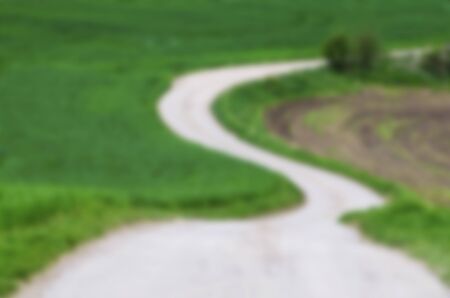 Rural landscape with green fields, blurred backgroundの写真素材