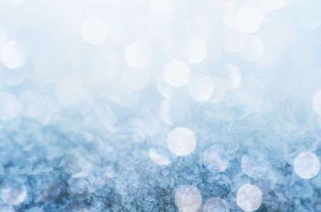 Winter iced blue shiny pattern with snowflakes, holiday seasonal backgroundの写真素材