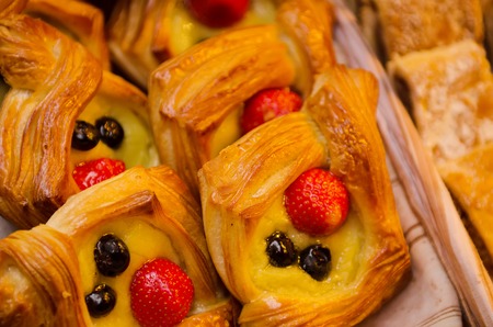 Delicious sweet puff pastry decorated with strawberry fruitの写真素材
