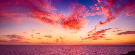 Beautiful colorful sunset at the sea with dramatic clouds. Beauty world natural outdoors travel...