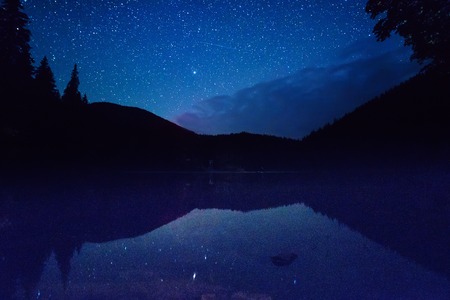 Mountain lake at nightの写真素材