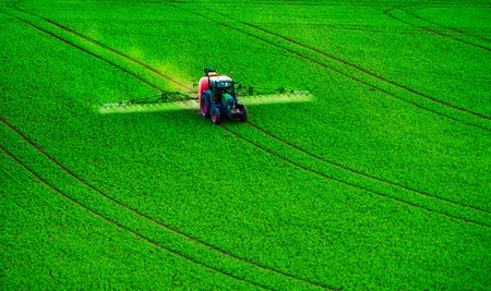 Farm machinery spraying insecticide