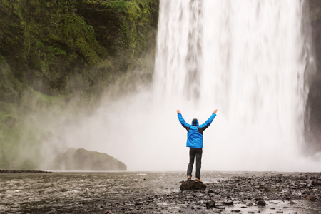 Man near waterfallの写真素材