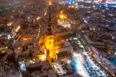 Aerial night View of Tallinn in winter, roofs are covered with snow, Christmas moodの写真素材