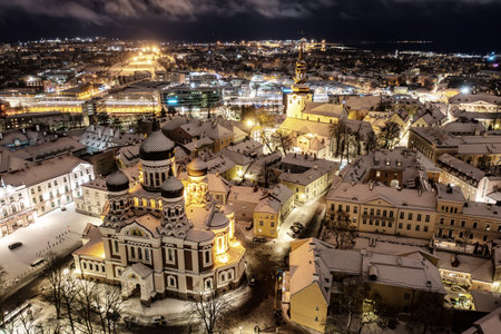 Aerial night View of Tallinn in winter with Alexander Nevsky Cathedral, roofs with snow, Christmas moodの写真素材