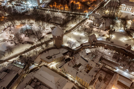 Aerial night View of Tallinn in winter, roofs are covered with snow, Christmas moodの写真素材