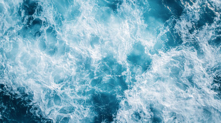 Beautiful aerial view of ocean waves with white foam in the turquoise sea, flat layの素材