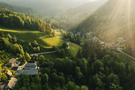 Calm idyllic village in Slovenian mountains at sunrise, summer travel concept