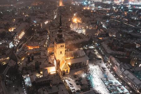Aerial night View of Tallinn in winter, roofs are covered with snow, Christmas moodの写真素材