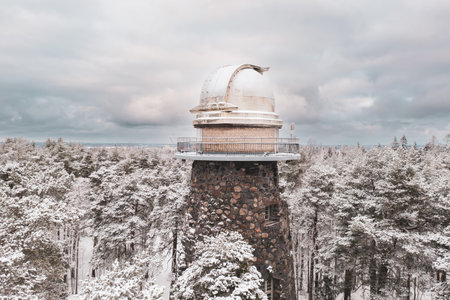 Old observatory tower in the Glen park. Tallinn, Estonia, against dramatic skyの写真素材
