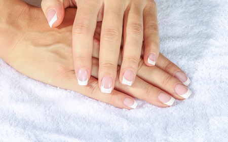 Beautiful woman\'s nails with beautiful french manicureの写真素材