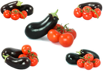 Eggplants on the cutting board with tomato setの写真素材