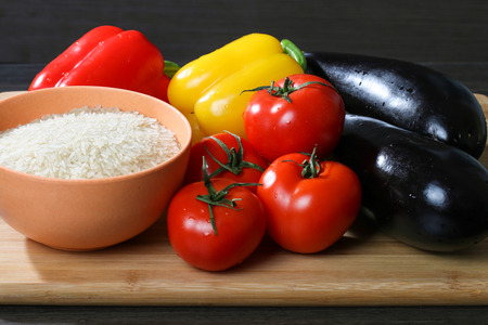 Raw rice  with fresh vegetable for cookingの写真素材