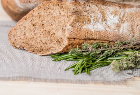 Fresh bread and rosemary close upの写真素材