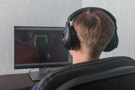 Man playing a computer games at home