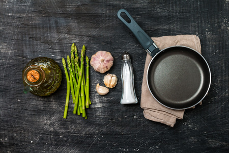 Ingredients for cooking asparagus on a black background, top viewの写真素材