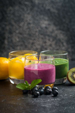 Colorful Healthy Fruit Smoothie on black backgroundの写真素材